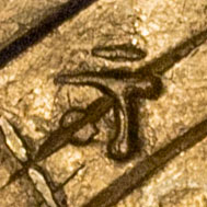Possibly 寸 - sun - a Japanese measurement of length equivalent to 10 分 (bu) or approximately 3.03 cm