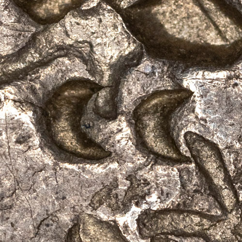 Small crescent moon chopmarks